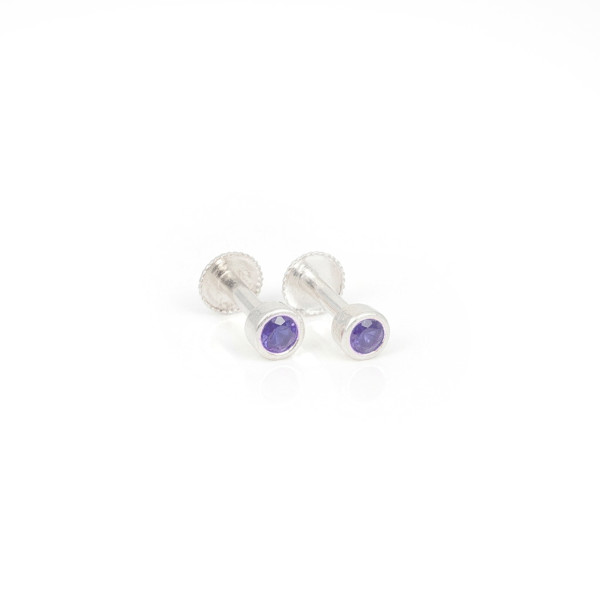 purple amethysts securely held in a polished bezel setting.